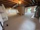 Unfinished basement with exposed beams and a sliding glass door leading to the backyard at 3223 Castle Peak Ave, Superior, CO 80027