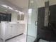 Modern bathroom featuring a sleek glass shower, stylish vanity, and contemporary finishes at 3223 Castle Peak Ave, Superior, CO 80027
