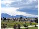 Scenic view of a residential community with beautiful landscaping and mountain views at 3223 Castle Peak Ave, Superior, CO 80027