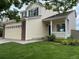 Charming home with a two-car garage, covered front porch, and well-maintained lawn at 3223 Castle Peak Ave, Superior, CO 80027