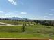 Expansive mountain views and lush green landscape offering a serene, picturesque setting at 3223 Castle Peak Ave, Superior, CO 80027