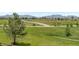 Peaceful neighborhood view featuring a greenbelt, walking trail, and mountain views at 3223 Castle Peak Ave, Superior, CO 80027