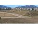 Beautiful neighborhood view with green spaces, walking trails, and mountain views at 3223 Castle Peak Ave, Superior, CO 80027