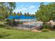 Community pool area with shaded lounge chairs, providing a refreshing oasis for relaxation and recreation during the summer months at 3223 Castle Peak Ave, Superior, CO 80027