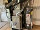 Close-up view of the home's updated Carrier furnace and water heater, ensuring efficiency and comfort for the household at 3223 Castle Peak Ave, Superior, CO 80027