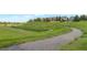 Scenic walking path winding through lush green spaces, offering a peaceful escape and a chance to connect with nature at 3223 Castle Peak Ave, Superior, CO 80027