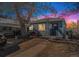 Charming single-story home with tidy landscaping and mature tree in the front yard at 47 Osceola St, Denver, CO 80219