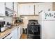 Functional kitchen features ample counter space and appliances at 47 Osceola St, Denver, CO 80219