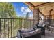 Outdoor patio featuring comfortable seating and a view of trees and blue sky at 875 E 78Th Ave # 7, Denver, CO 80229