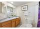 Cozy bathroom featuring a vanity with storage, a toilet, and a shower with curtain at 875 E 78Th Ave # 7, Denver, CO 80229