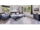 Inviting bedroom with hardwood floors, soft lighting, and a comfortable queen-sized bed at 875 E 78Th Ave # 7, Denver, CO 80229