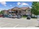 A residential apartment complex with stone accents and a well-maintained parking area at 875 E 78Th Ave # 7, Denver, CO 80229