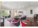 Open-concept living room featuring hardwood floors and a balcony at 875 E 78Th Ave # 7, Denver, CO 80229
