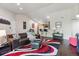 Cozy living room with hardwood floors, open to kitchen area at 875 E 78Th Ave # 7, Denver, CO 80229