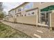 View of a well-kept backyard, featuring a patio area with outdoor seating, landscaping and privacy fence at 4346 S Quail St, Littleton, CO 80127