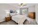 Comfortable bedroom with natural light, ceiling fan, and neutral decor at 4346 S Quail St, Littleton, CO 80127