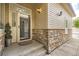 Inviting front entryway with stone accents and stylish outdoor lighting at 4346 S Quail St, Littleton, CO 80127