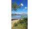 Scenic view of the lake and mountains in the distance, surrounded by lush greenery and a blue sky at 4346 S Quail St, Littleton, CO 80127