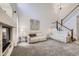 Spacious living room featuring tall ceilings, a staircase, and comfortable seating at 4346 S Quail St, Littleton, CO 80127