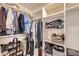 Organized walk-in closet with shelves, hanging rods, and ample storage space for clothes and accessories at 4346 S Quail St, Littleton, CO 80127