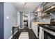 Galley kitchen with stainless steel appliances and wood countertops at 1310 N Corona St # A, Denver, CO 80218
