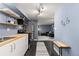 Galley kitchen features stainless steel appliances, butcher block countertops, and open shelving at 1310 N Corona St # A, Denver, CO 80218