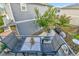 A cozy backyard is shown, with a dining and lounge set at 240 S Oak Hill St, Aurora, CO 80018