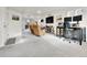 Spacious finished basement with dual work stations, comfortable lounge seating, and easy access to the backyard at 240 S Oak Hill St, Aurora, CO 80018