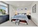 Comfortable bedroom boasts a large bed with patterned bedding and an adjacent dark dresser at 240 S Oak Hill St, Aurora, CO 80018