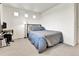 Comfortable bedroom with neutral carpet, a vintage lamp, and a bed with decorative metal headboard at 240 S Oak Hill St, Aurora, CO 80018