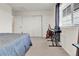 This bedroom includes a large window, and a sliding door closet for additional storage space at 240 S Oak Hill St, Aurora, CO 80018