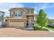 Desirable two-story home with a brick driveway and attractive stone and siding accents at 240 S Oak Hill St, Aurora, CO 80018