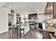 Well-appointed kitchen features an island, stainless steel appliances, and ample cabinet space at 240 S Oak Hill St, Aurora, CO 80018