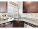 Gourmet kitchen featuring granite countertops, stainless steel appliances, and modern cabinetry at 240 S Oak Hill St, Aurora, CO 80018
