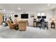 The open living space offers seating, a TV, and dedicated office and exercise areas at 240 S Oak Hill St, Aurora, CO 80018