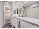 Bright bathroom with a tiled shower, white cabinets, granite countertop, and stylish fixtures at 7640 S Monaco W Cir, Centennial, CO 80112