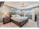 Serene bedroom featuring a large bed, ceiling fan, natural light, and comfortable furnishings at 7640 S Monaco W Cir, Centennial, CO 80112