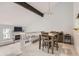 Bright dining area featuring hardwood floors, open floor plan, and easy access to the living room with fireplace at 7640 S Monaco W Cir, Centennial, CO 80112
