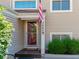 Inviting front entrance with a charming door and well-maintained landscaping at 7640 S Monaco W Cir, Centennial, CO 80112