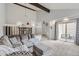 Comfortable living room featuring plush seating, carpet floors, and an open staircase to the dining area at 7640 S Monaco W Cir, Centennial, CO 80112