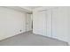 Simple basement bedroom with double door closet and neutral decor at 995 S Upham St, Lakewood, CO 80226