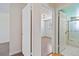 Clean bathroom with updated vanity and shower at 995 S Upham St, Lakewood, CO 80226