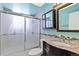 Updated bathroom with granite vanity and shower/tub at 995 S Upham St, Lakewood, CO 80226