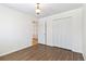 Bedroom with wood-look flooring and built-in closet at 995 S Upham St, Lakewood, CO 80226