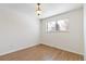 Well-lit bedroom with wood-look flooring and a closet at 995 S Upham St, Lakewood, CO 80226