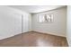 Spacious bedroom with wood-look flooring and large closet at 995 S Upham St, Lakewood, CO 80226