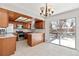 Spacious kitchen with granite countertops and wooden cabinets at 995 S Upham St, Lakewood, CO 80226