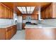 U-shaped kitchen with stainless steel appliances and granite counters at 995 S Upham St, Lakewood, CO 80226