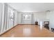 Bright living room with hardwood floors and window views at 995 S Upham St, Lakewood, CO 80226