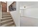 Carpeted staircase and landing at 995 S Upham St, Lakewood, CO 80226